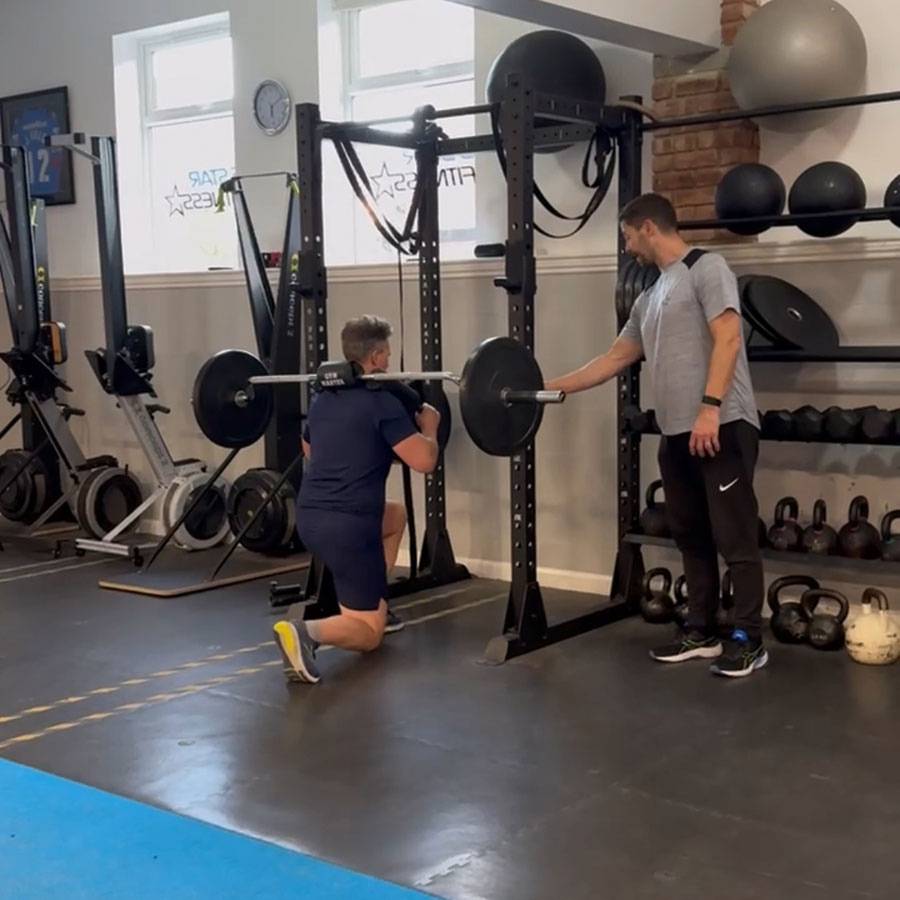 Personal trainer coaching a client during strength training near Collingham at our Wetherby studio