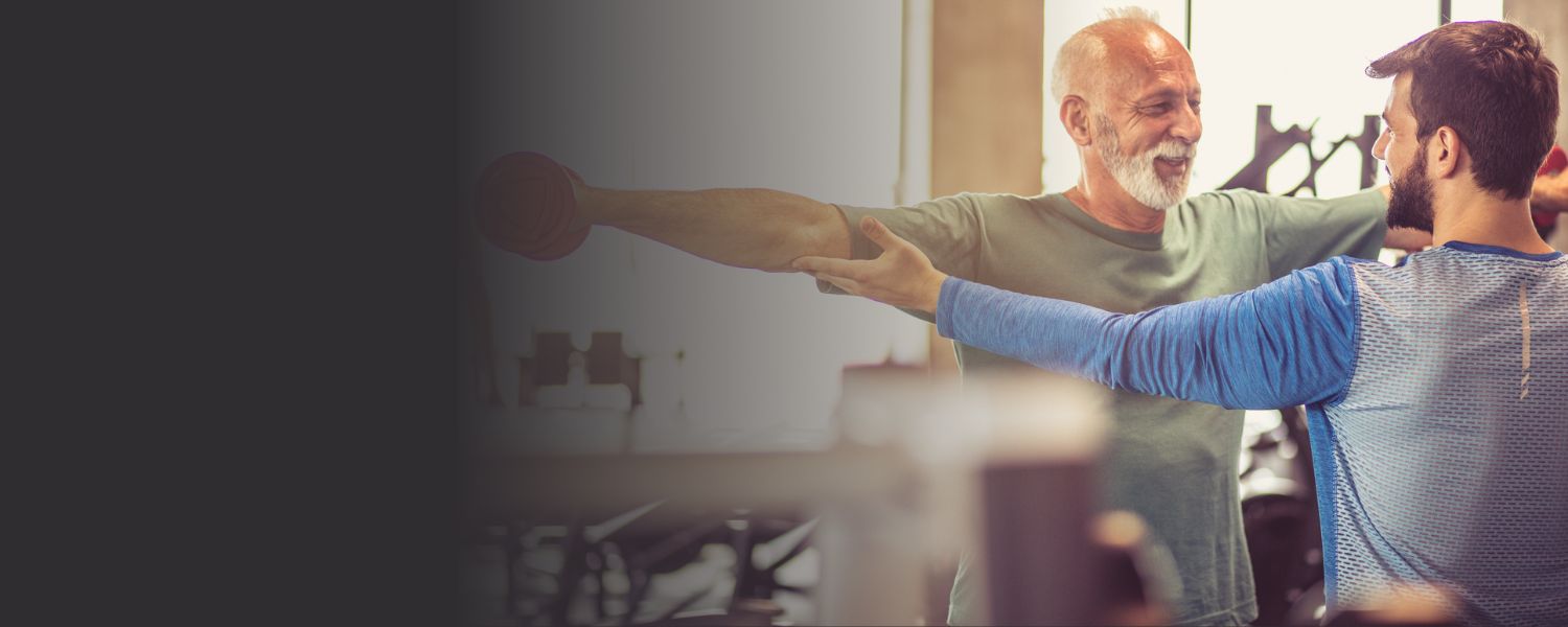 Personal trainer supporting a client during a session at our Wetherby studio